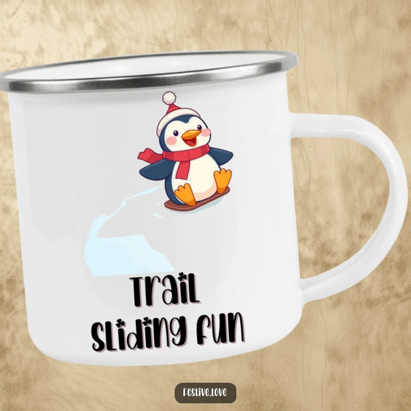 Funny camping mug with a happy penguin character gleefully sliding down a frosty, icy hill.