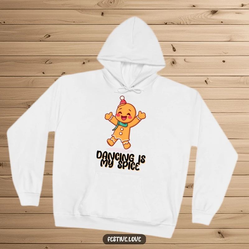 Funny hoodie with a giggling gingerbread man character performing a festive jig, providing warmth and holiday cheer.