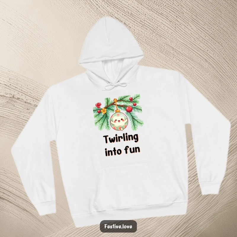 Funny hoodie showcasing a festive ornament character gleefully spinning on a decorated Christmas tree branch, perfect for cozy holiday wear.