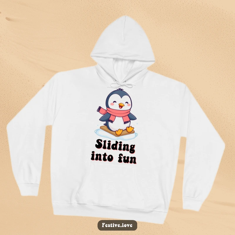 Funny hoodie depicting a joyful penguin wearing a scarf, expertly sliding across ice with a happy expression.
