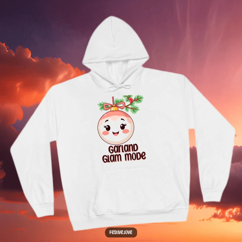 Funny hoodie depicting a smiling ornament character with a cheerful expression, hanging festively from a Christmas garland.
