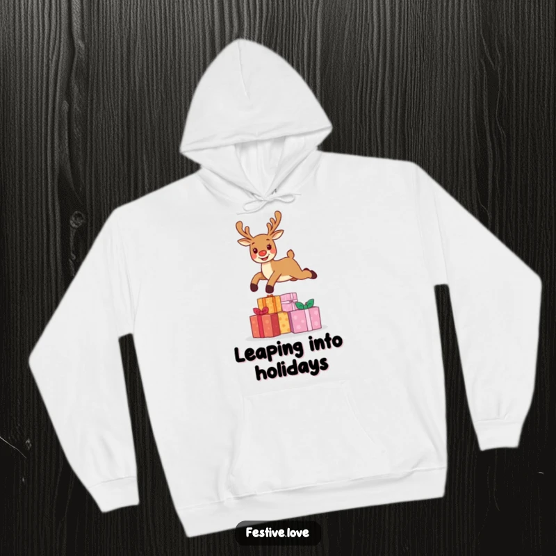 Funny hoodie displaying a cheerful reindeer character energetically leaping over a generous stack of Christmas gifts, celebrating the holiday season.