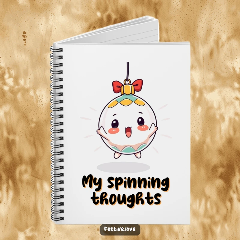 Funny notebook with a surprised Christmas ornament character spinning rapidly, designed for jotting down holiday plans with a fun twist.