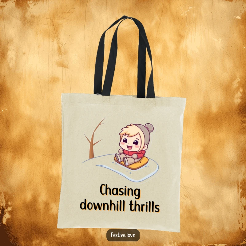 Funny tote bag illustrating a character sledding with a big grin down a snow-covered hill, perfect for carrying winter essentials.