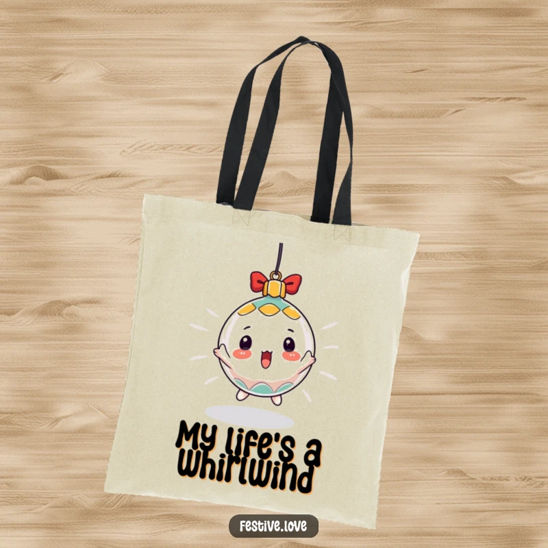 Funny tote bag featuring a surprised Christmas ornament character spinning rapidly, ideal for carrying holiday items with festive flair.